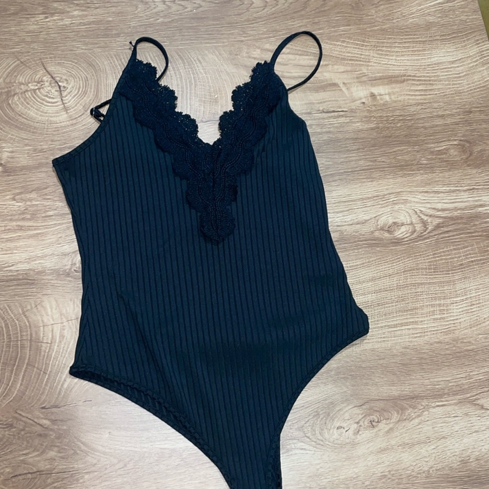 Black bodysuit with lace neckline